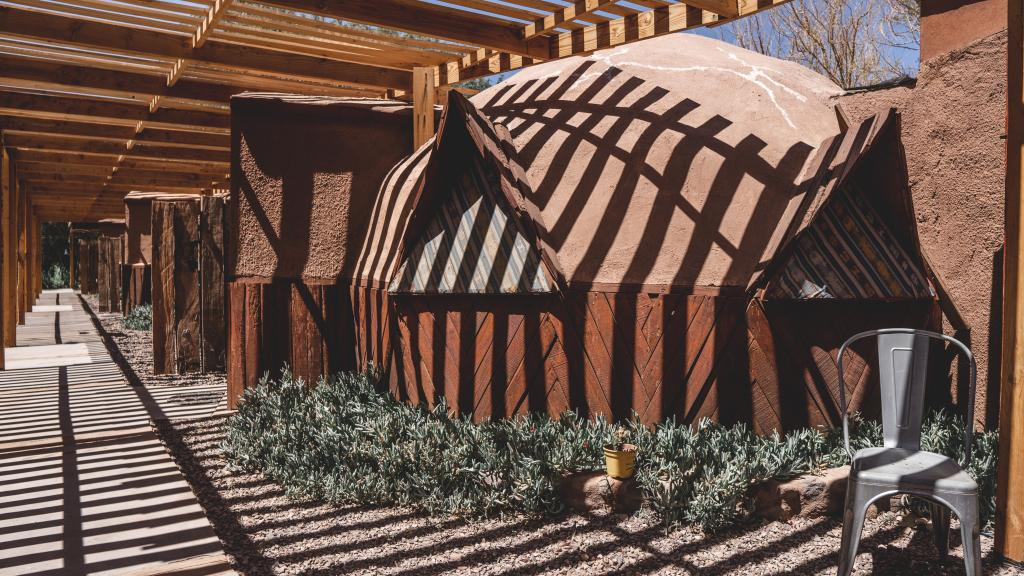 Adobe dome and shaded walkway at San Pedro Domas, a 10-minute walk from the main square