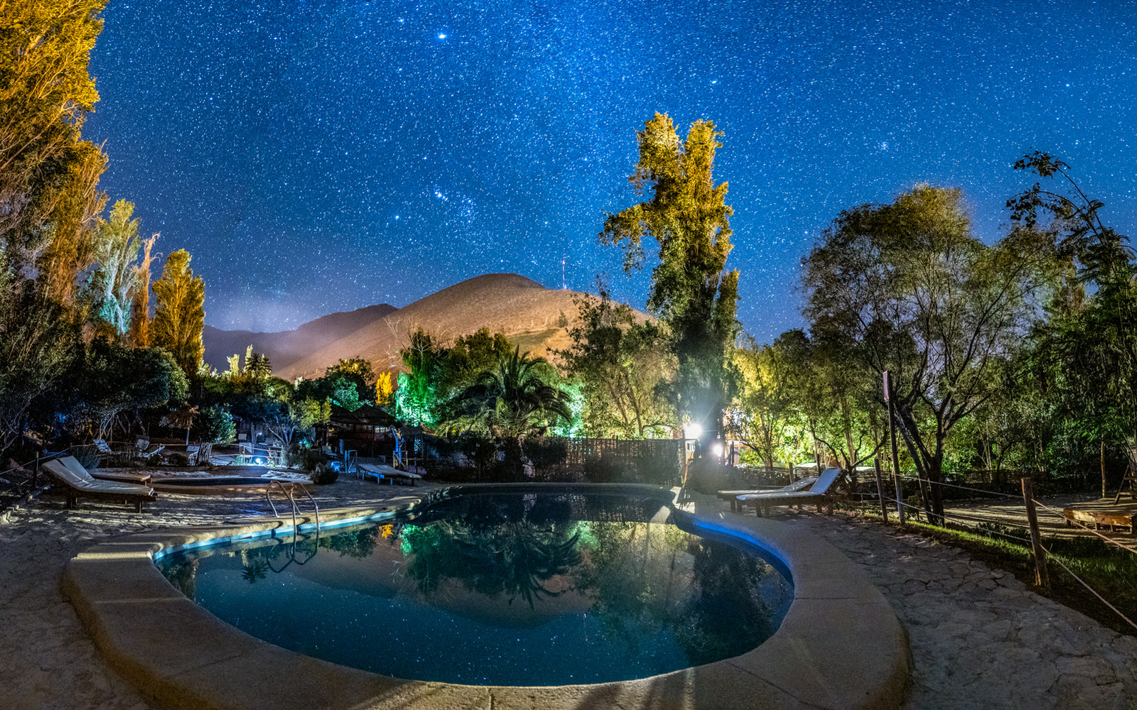 The pool at El Tesoro de Elqui beneath a sky filled with stars